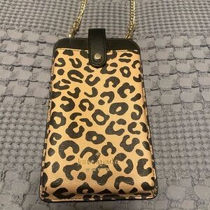 Kate Spade remi graphic leopard colorblock north south tab phone crossbody bag.